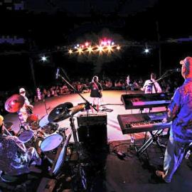 a stage photographed from behind the performers. 