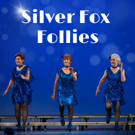 Three Tap dancers on stage wearing blue dresses. Silver Fox Follies.