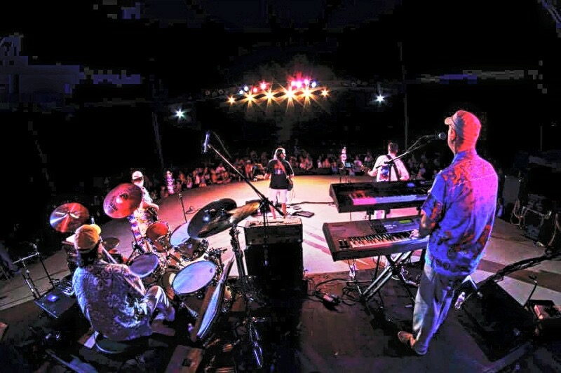 a stage photographed from behind the performers. 