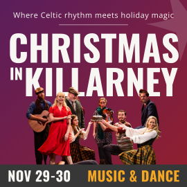 Purple background with white text that reads Christmas in Killarney, November 29th-30th, Music & Dance. Along the bottom of the image is 8 individuals dressed in cheerful festive suits and dresses. Three of the performers are kneeling and gesturing to a cake they are holding up. 